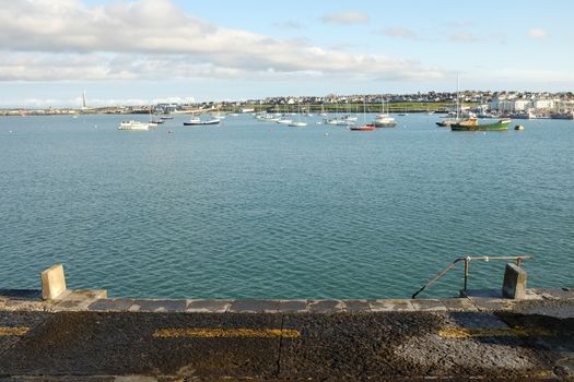 A view from the quayside wall out across the moorings of Holyhead marina, Anglesey, Wales, UK.