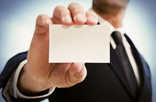 Man's hand showing business card