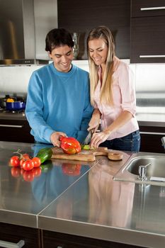 Couple cutting a vegetable