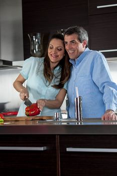 couple cooking in the  kitchen