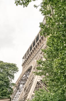 La Tour Eiffel, Paris. Landmark surrounded by trees in summer.