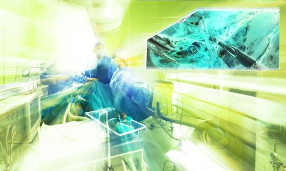 Abstract blurred image of hospital surgery room with team of doctors operating.