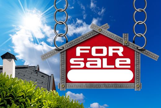 Grey metallic meter ruler in the shape of house with text for sale. For sale real estate sign on blue sky with roof, clouds and sun rays