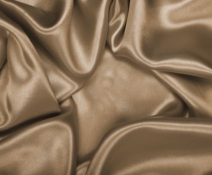 Smooth elegant golden silk or satin can use as wedding background. In Sepia toned. Retro style