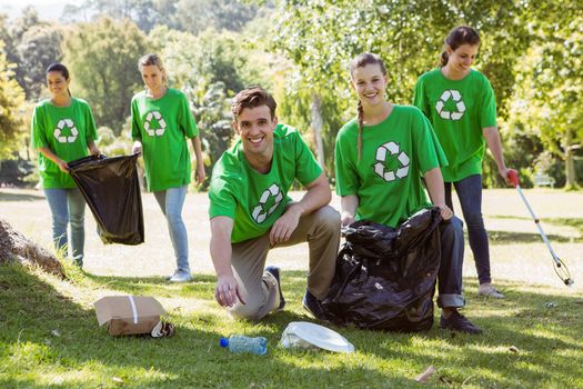 Environmental activists picking up trash on a sunny day