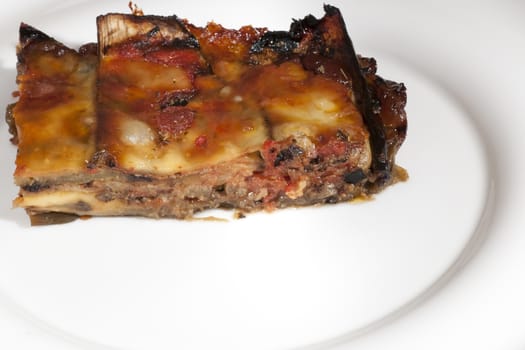 delicious eggplant parmesan served on a white plate