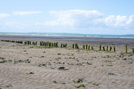 old wave breakers at the mouth of the cashen on ballybunion beach on the wild atlantic way