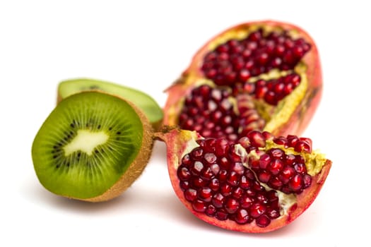 Pomegranate and Kiwi fruit isolated on white background