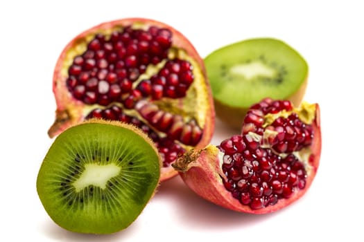 Pomegranate and Kiwi fruit isolated on white background