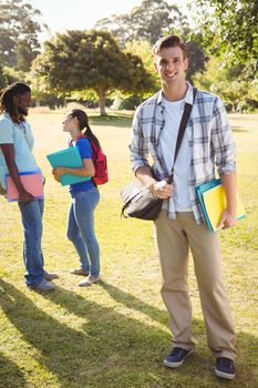 Happy students outside on campus on a sunny day