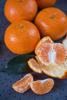Ripe tangerines on wooden background