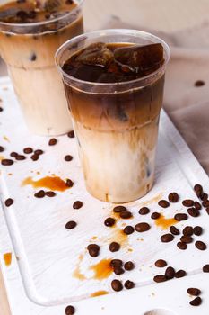 Delicious coffee with ice cubes