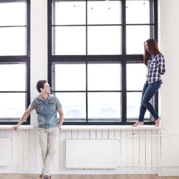 Love, relationship. Beautiful couple by the window