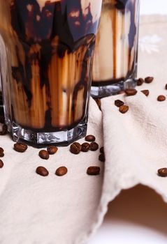 Delicious coffee with ice cubes