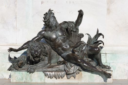 Allegorical statue of the Rhone river, under the statue of Louis XIV. Bellecour square, Lyon, France