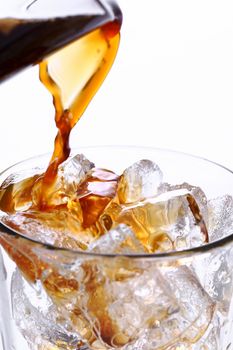 Glass of cold coffee on a white background