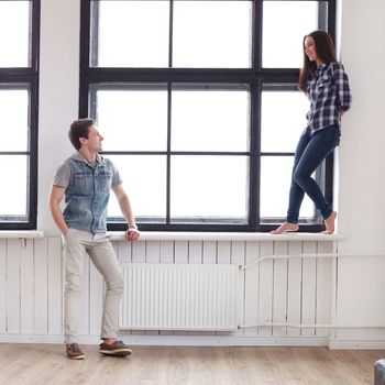 Love, relationship. Beautiful couple by the window