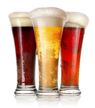 Tall glasses of beer isolated on a white background
