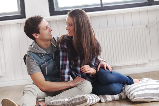 Love, relationship. Beautiful couple on the floor