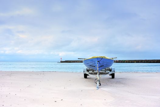 Old fishing boat on the sandy beach