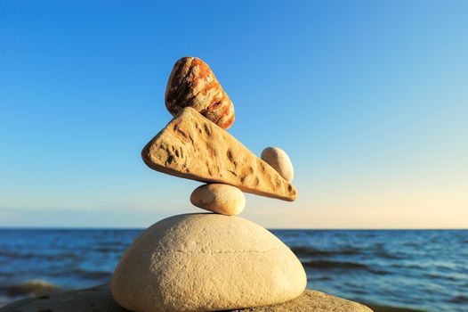 Balancing of stones each other on the seashore