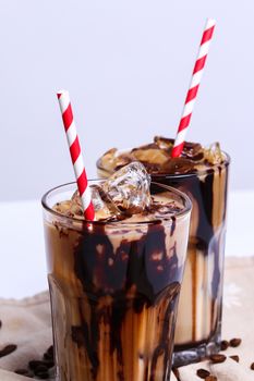 Delicious coffee with ice cubes