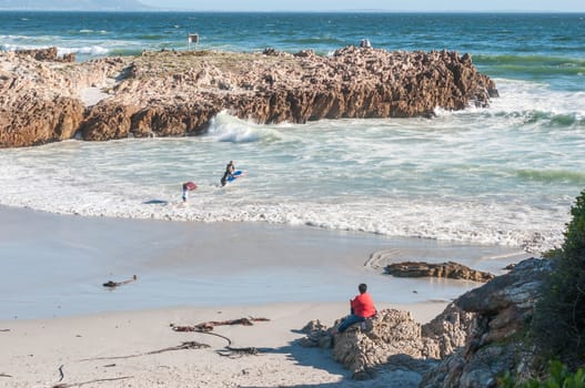 HERMANUS, SOUTH AFRICA - DECEMBER 10, 2014:  Unidentified people at a secluded beach in Hermanus