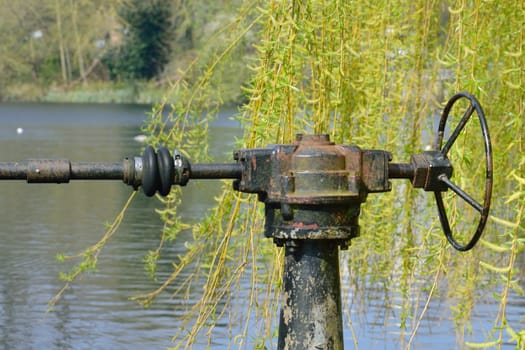 Vintage lock mechanism by pond