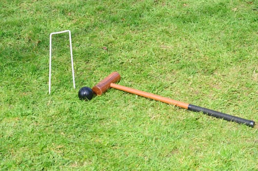 Croquet Hoop mallet and ball in landscape