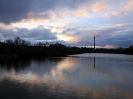 Stormy sky over the night river. Sillamae town. Estonia