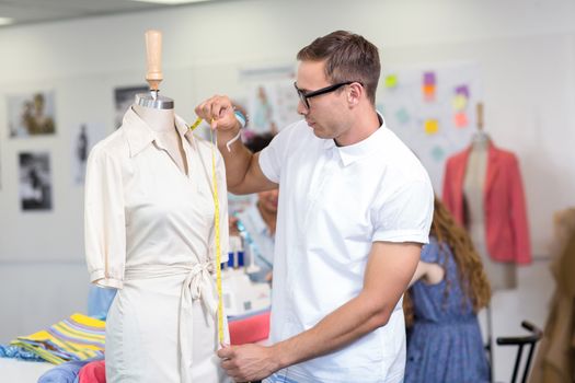 Portrait of male fashion designer at work