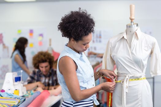 Portrait of female fashion designer at work