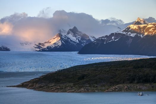 First rays of dawn sunlight on the peaks around the Perito Moreno Glacier. A glacier located in the Los Glaciares National Park in Patagonia in the southwest of Santa Cruz province in Argentina. 