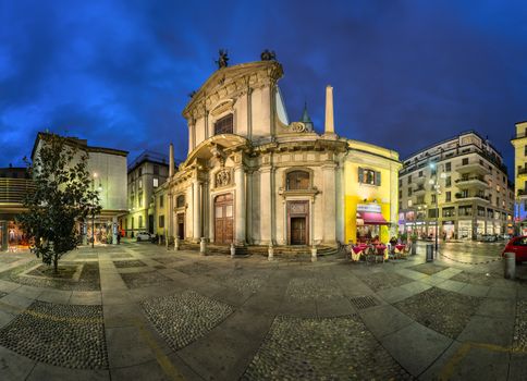 MILAN, ITALY - JANUARY 13, 2015: Saint George Church (Chiesa San Giorgio al Palazzo) and Torino Street in Milan. The church was founded around 750 by archbishop Natalis, and was modernized in Baroque style by Francesco Maria Richini in 1623