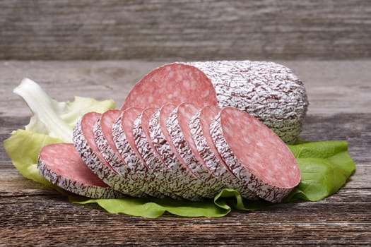 Salami sausage on wooden table