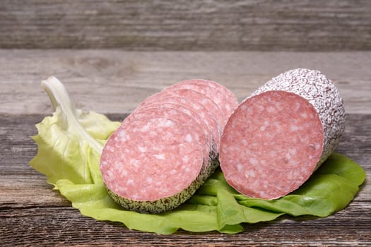 Salami sausage on wooden table