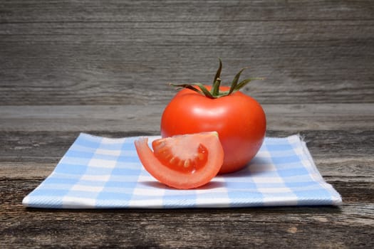 Fresh tomatoes on wooden background
