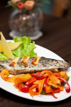 Tasty dish of rainbow trout fish with vegetables