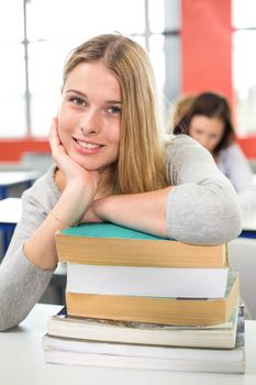 Close up portrait of smiling female student in classroom