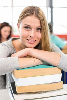 Close up portrait of smiling female student in classroom