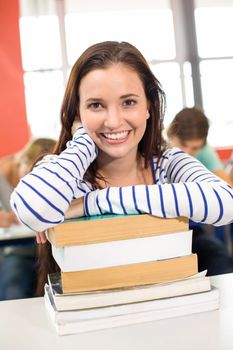 Close up portrait of smiling female student in classroom