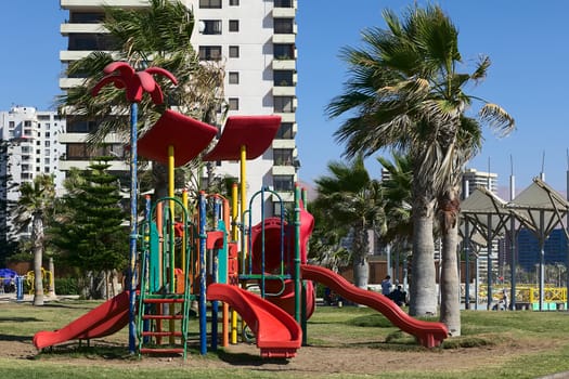 IQUIQUE, CHILE - FEBRUARY 10, 2015: Colorful slide on playground along Cavancha beach on February 10, 2015 in Iquique, Chile. Iquique is a popular beach town and free port city in Northern Chile. 