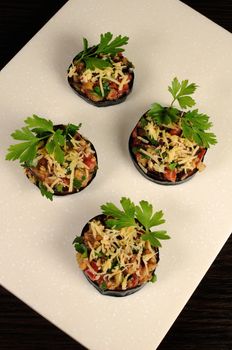 Appetizer of fried eggplant stuffed with vegetables and cheese