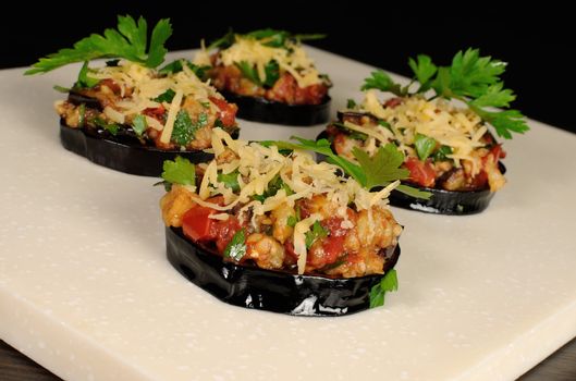Appetizer of fried eggplant stuffed with vegetables and cheese