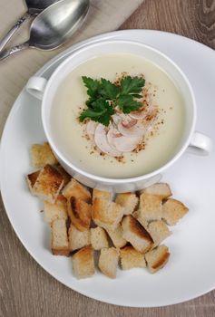 Plate of mushroom soup mashed spiced crispy bread croutons