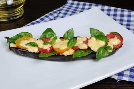 Baked eggplant with tomato cheese and basil