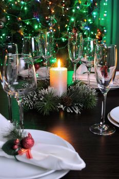 Candle and cones as an element of decor Christmas table