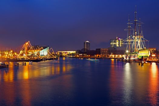 The harbor from Amsterdam in the Netherlands by night at christmas