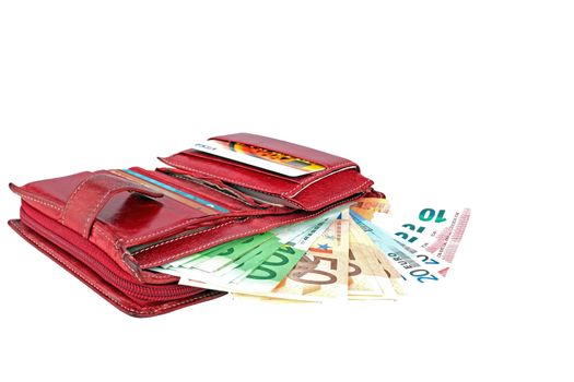 Red wallet full with euro banknotes on a white background.