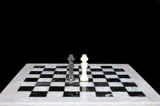 Who is the winner. King vs king on a marble chess board